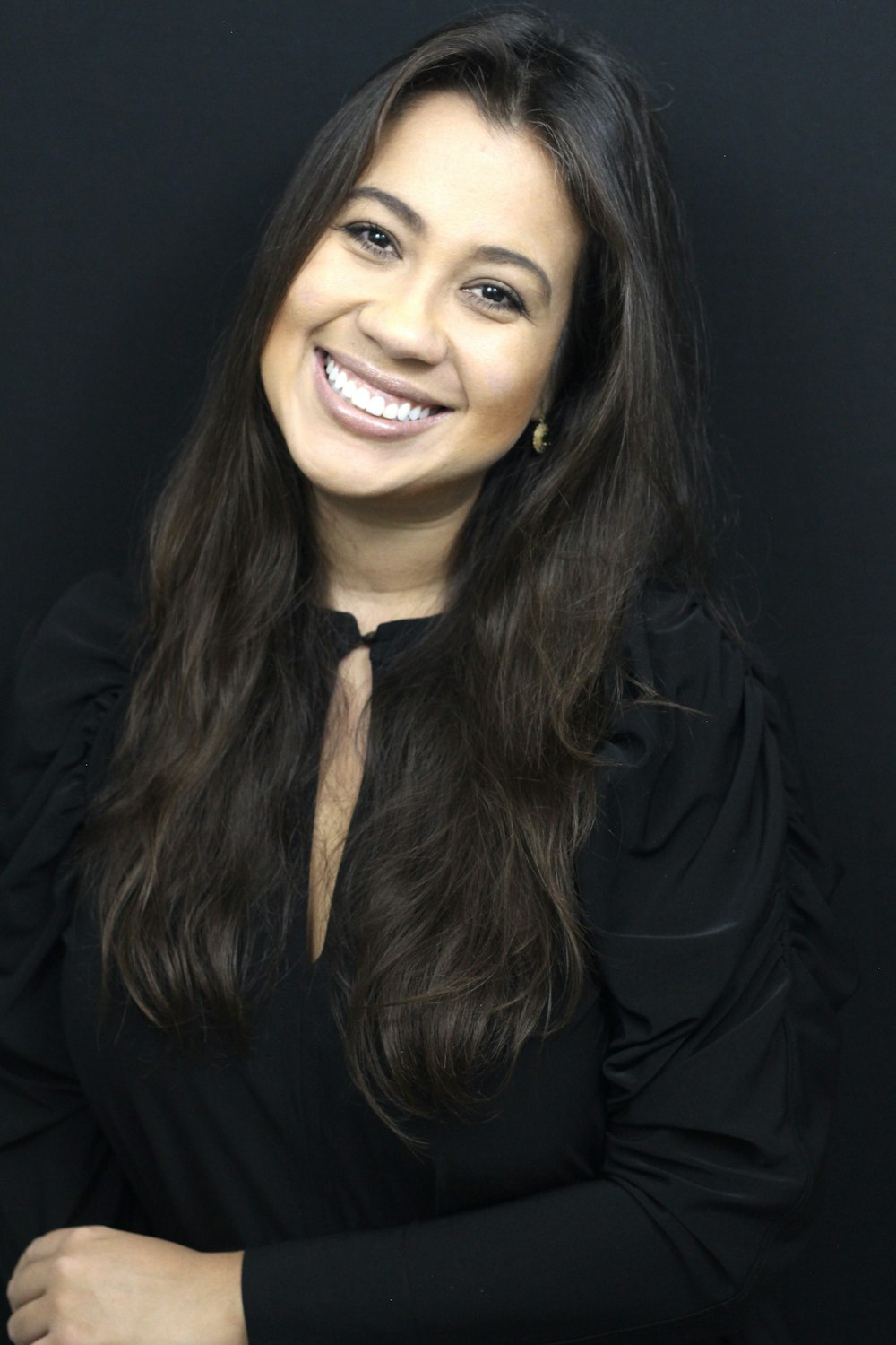woman in black long sleeve shirt smiling