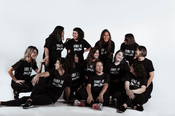 group of people sitting on white floor