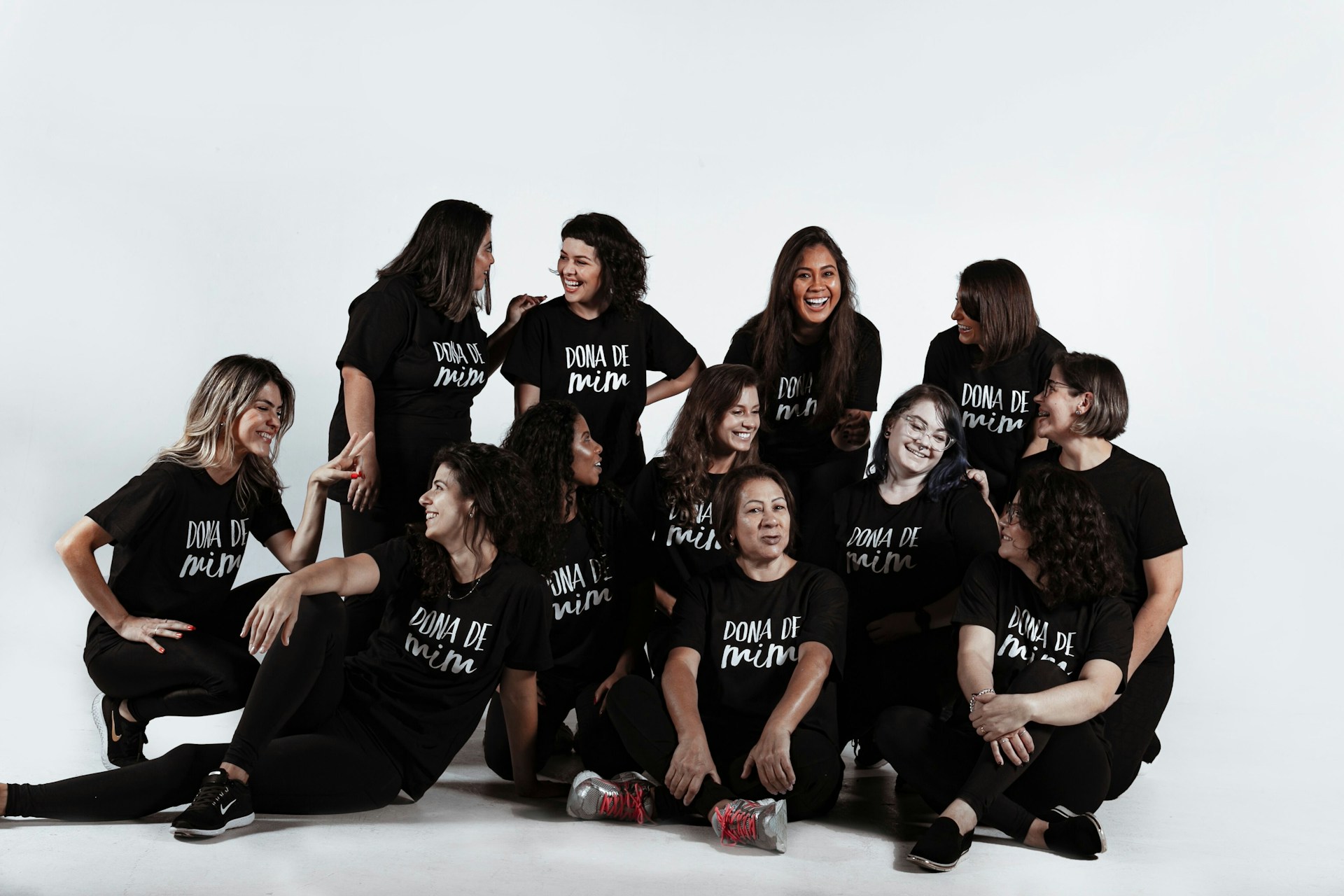 group of people sitting on white floor