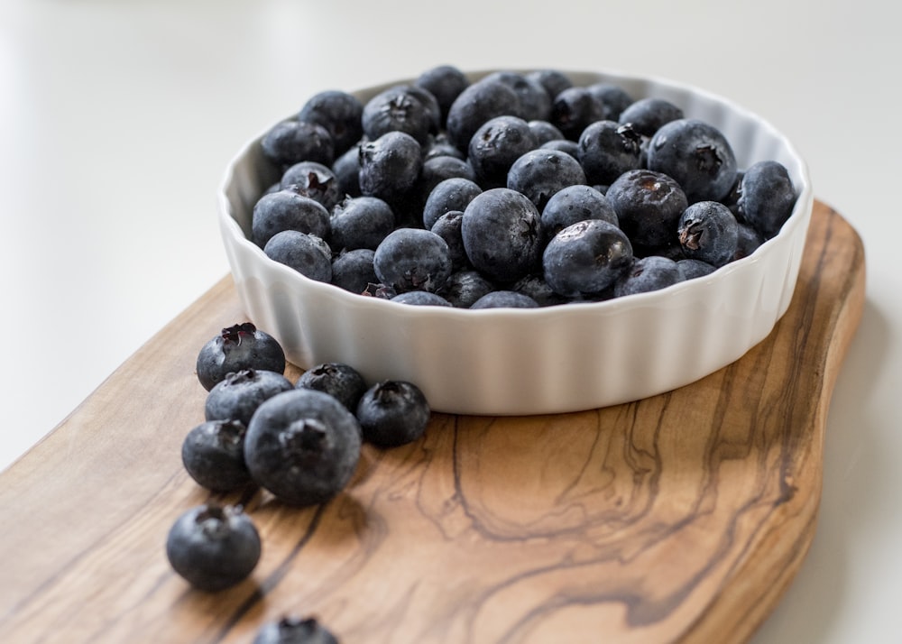 black berries in white ceramic bowl