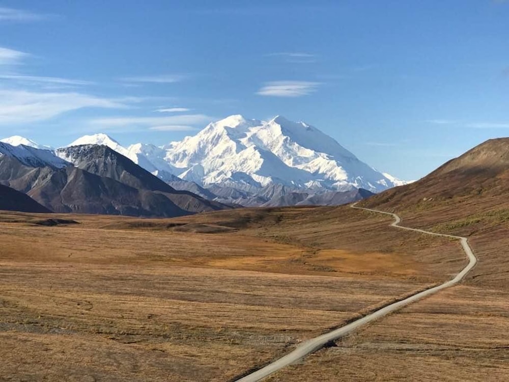 brown and white mountains under blue sky during daytime