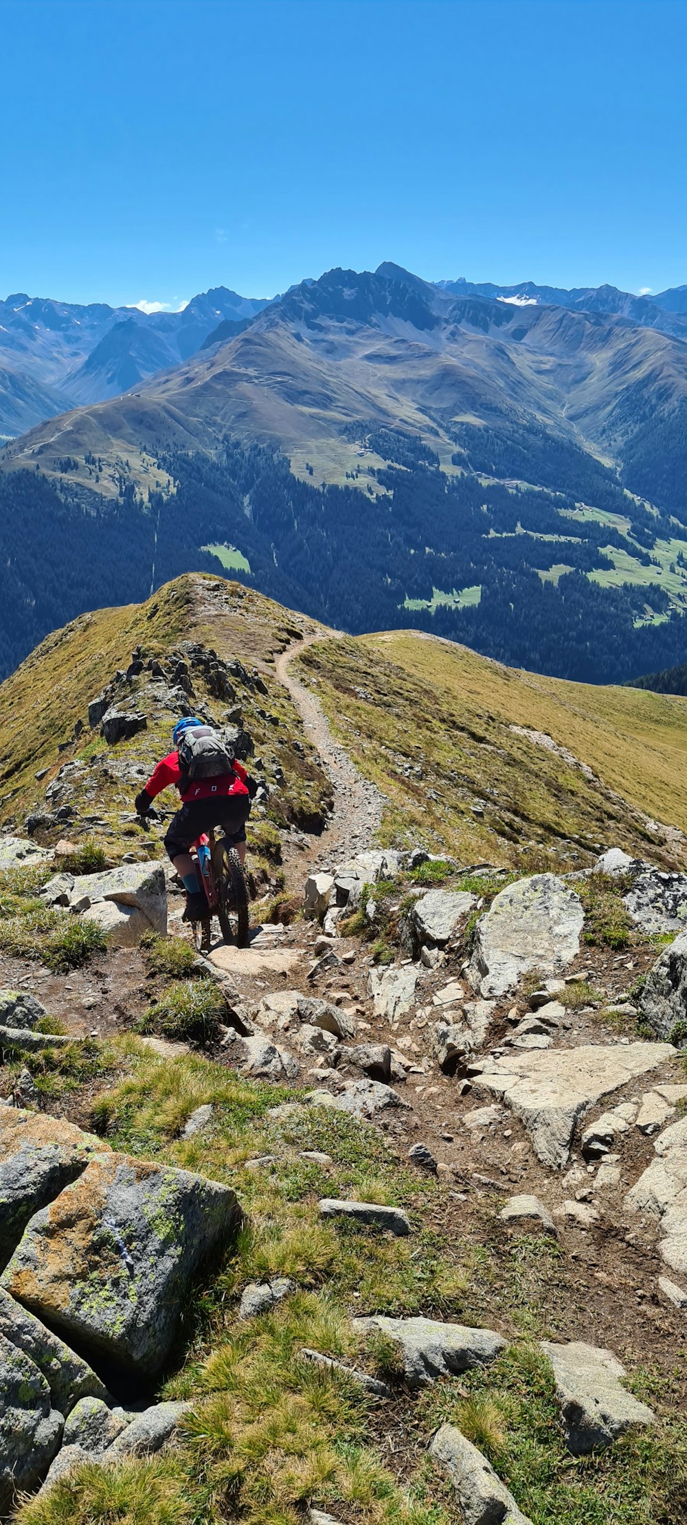 2 people hiking on mountain during daytime