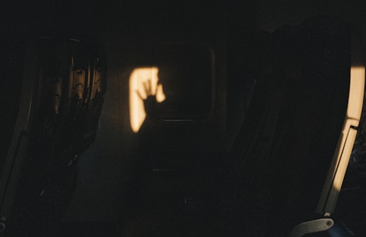 persons hand on black surface