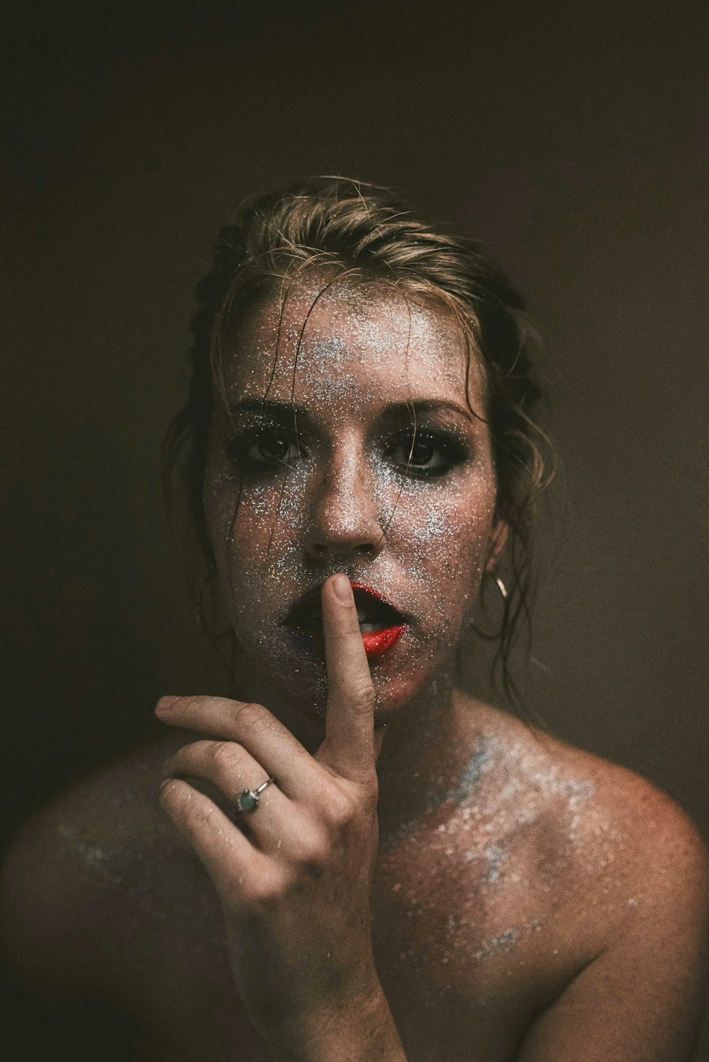 woman with red lipstick and black mascara