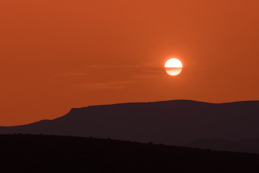 silhouette of mountain during sunset