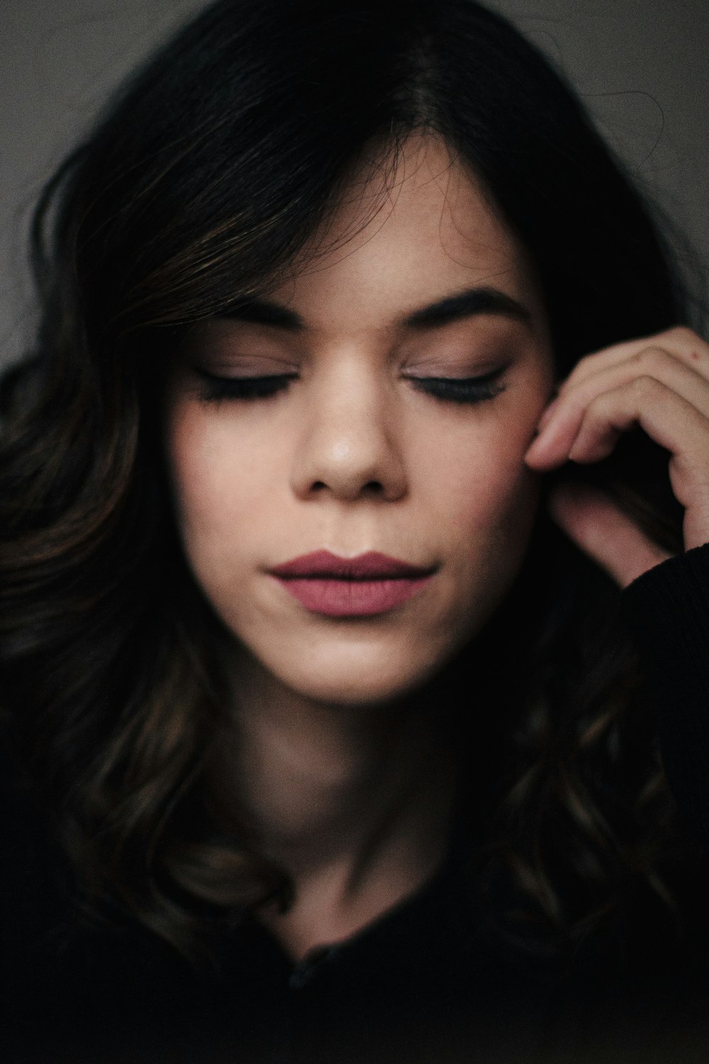 woman in black shirt with red lipstick