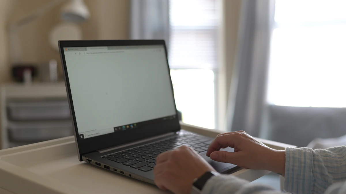 Two people comparing options on a laptop screen