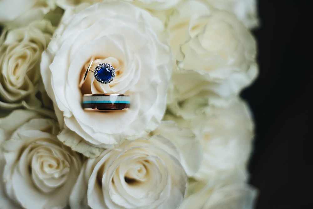 silver ring on white flower