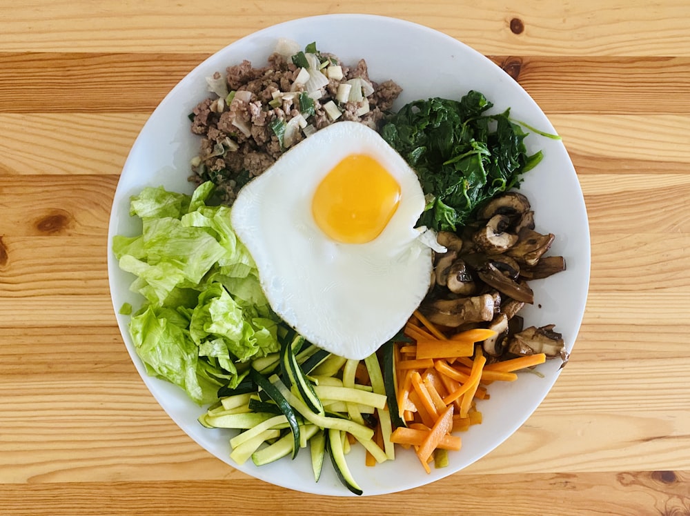 egg on white ceramic plate