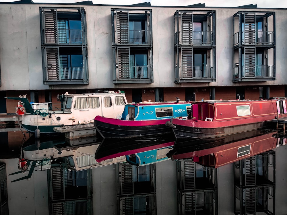 red and white boat on body of water during daytime