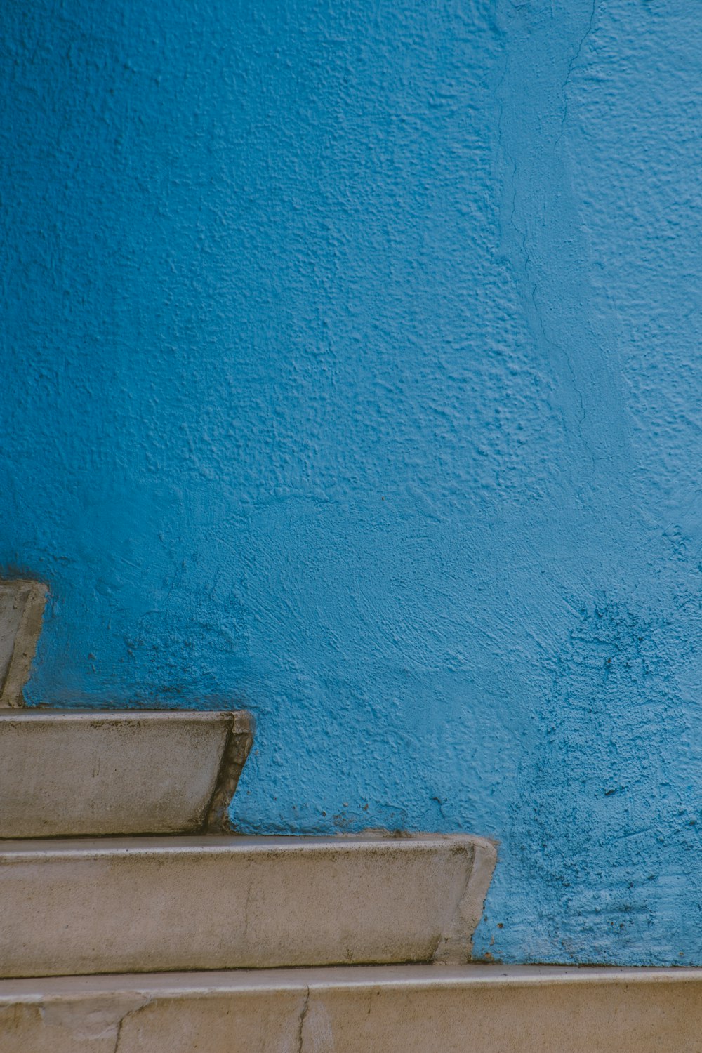 blue concrete wall during daytime