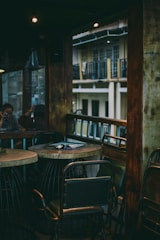 A rustic metal and wood dining table set in a cozy home setting.