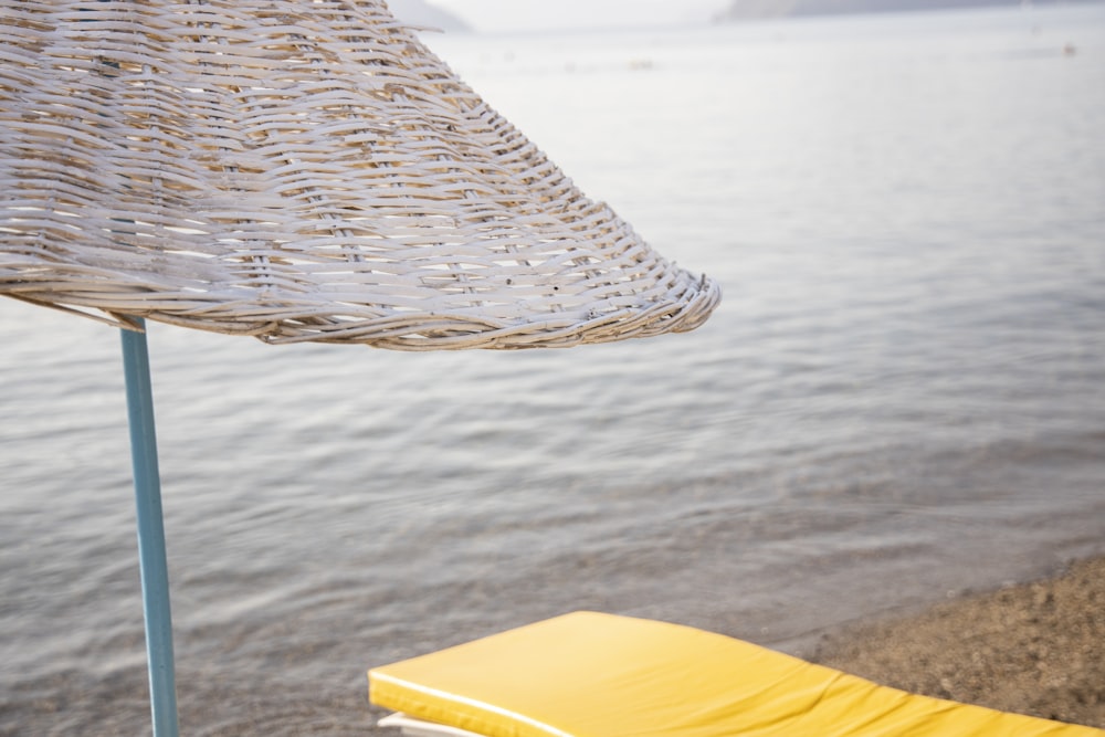 brown woven hammock on body of water