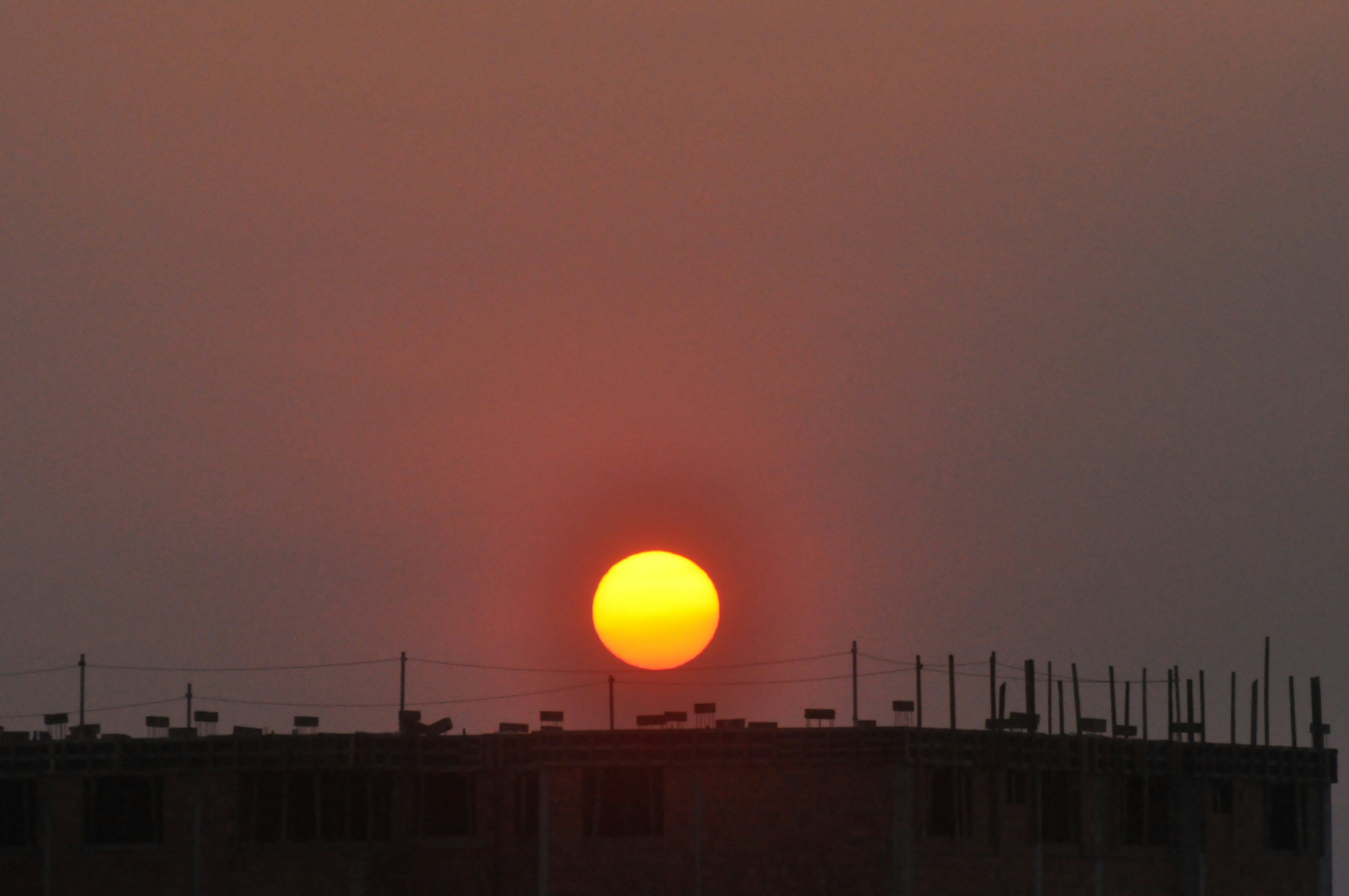 silhouette of building during sunset