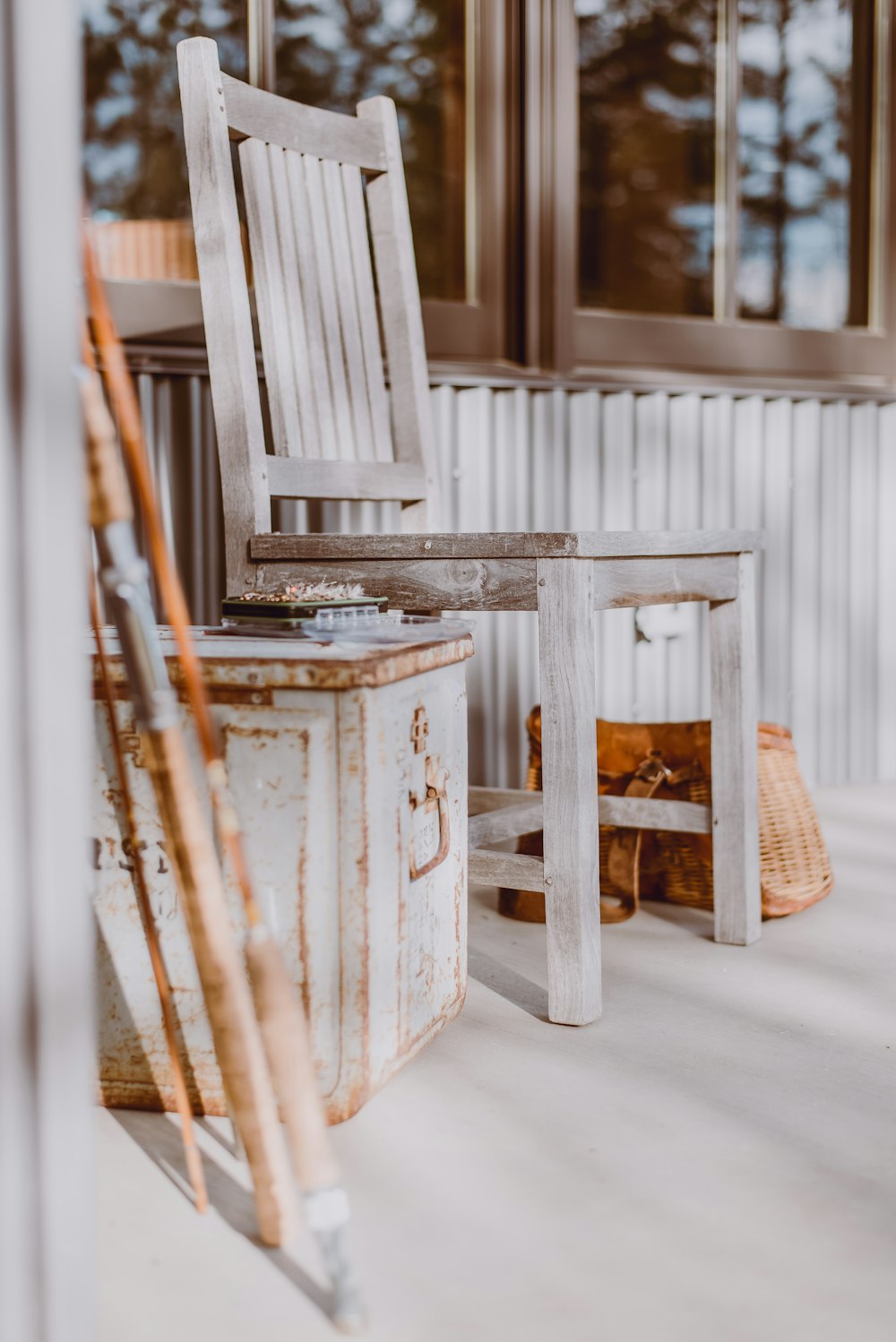 brown wooden seat beside wooden wall