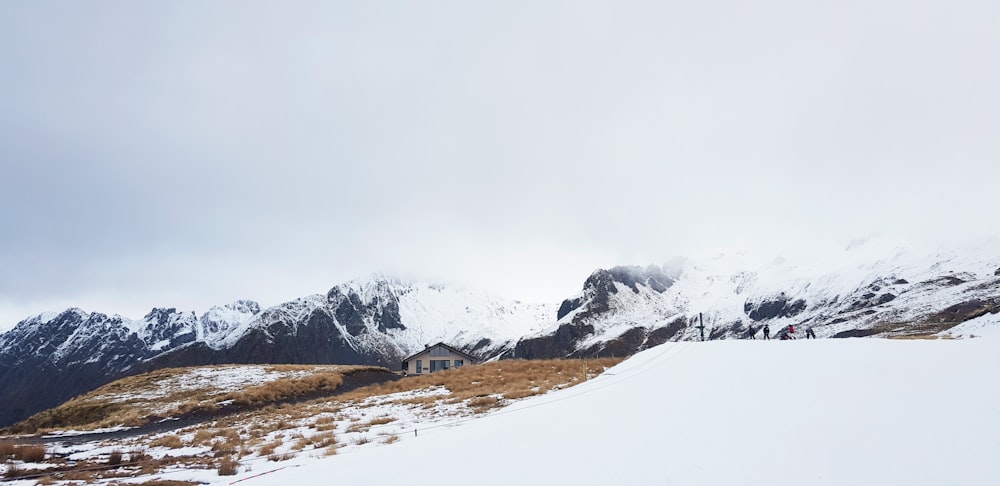 snow covered mountain under white sky during daytime