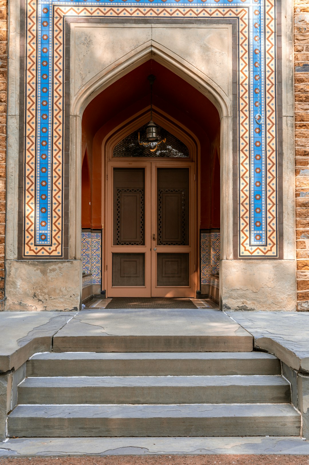 brown wooden door on brown concrete building