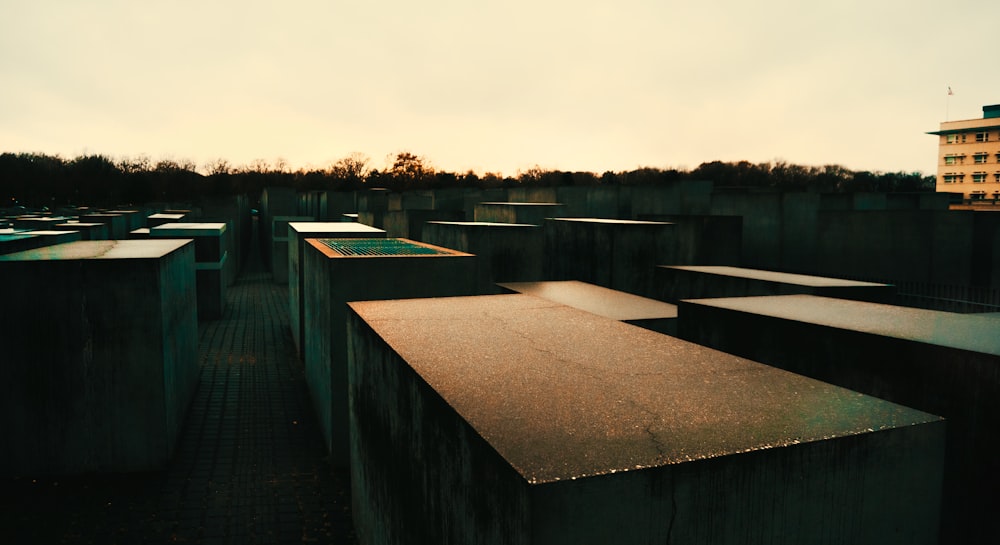 gray concrete bench near body of water during daytime