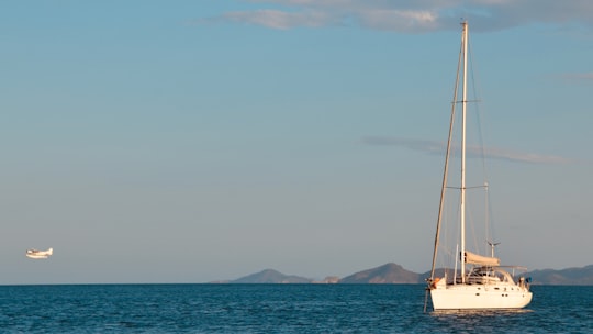 white sailboat on sea during daytime in Whitsundays QLD Australia