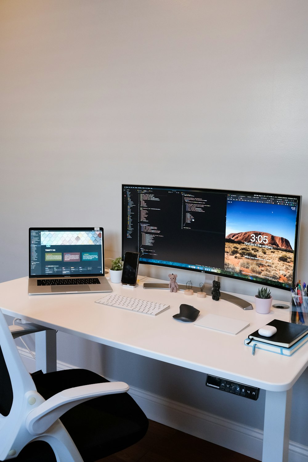 black flat screen computer monitor on white wooden desk