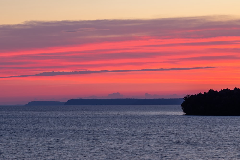 body of water during sunset