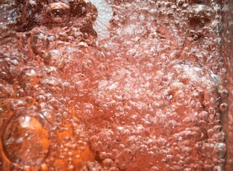 water droplets on brown surface