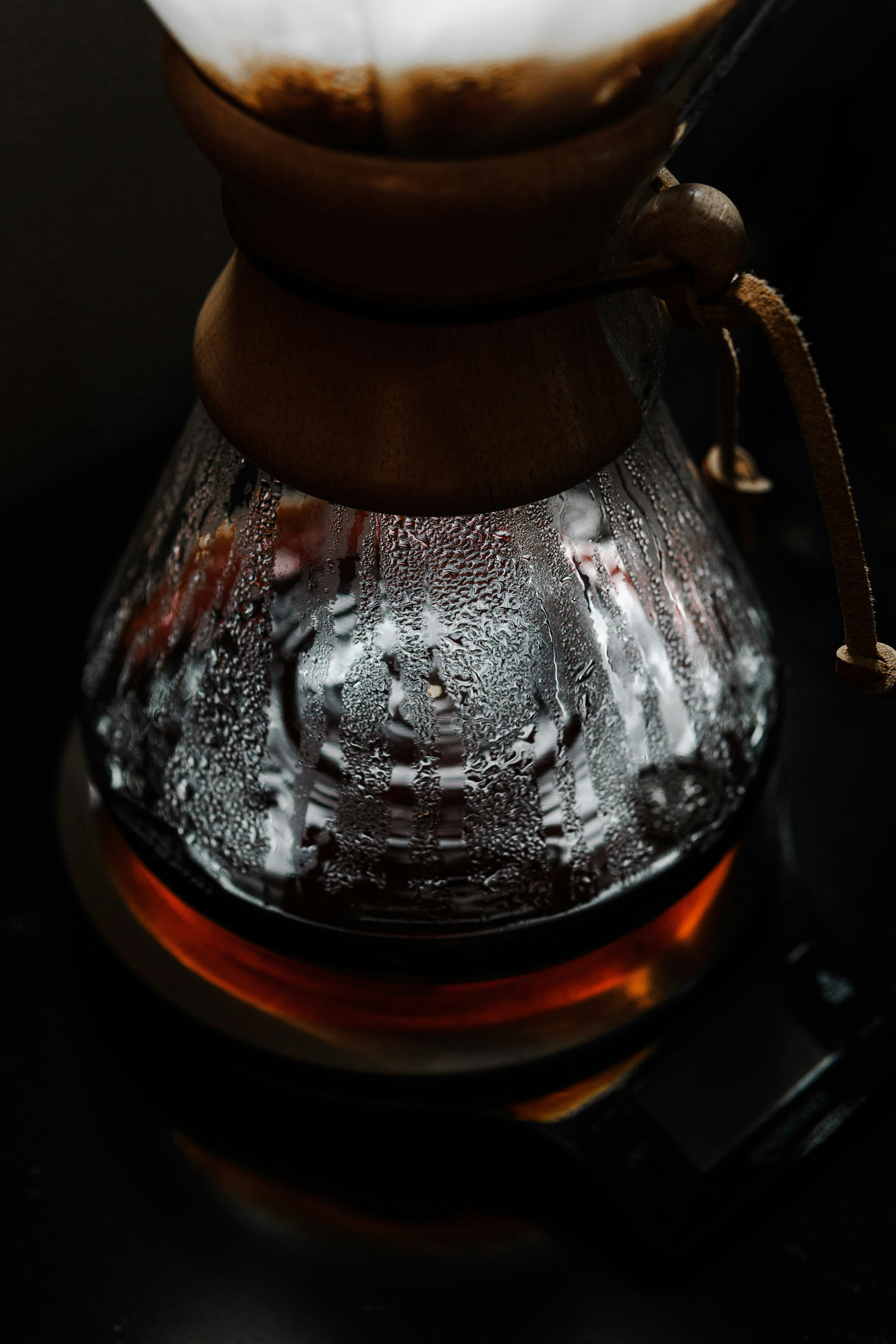 clear glass jar with brown liquid