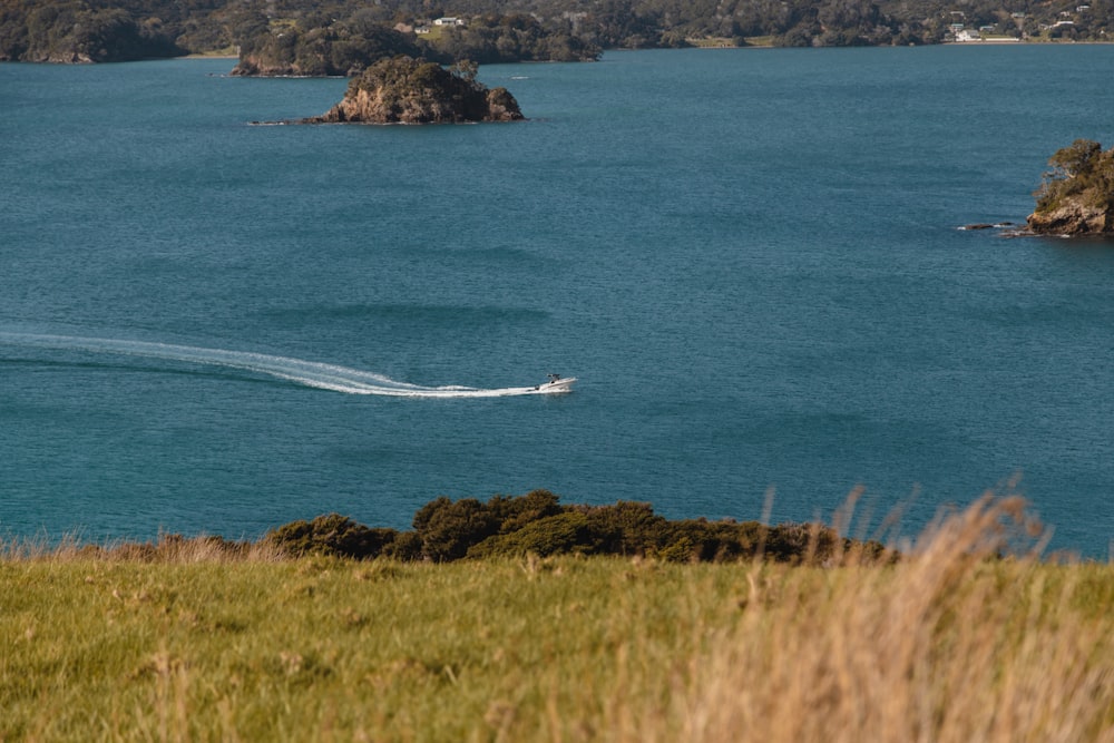 white boat on blue sea during daytime