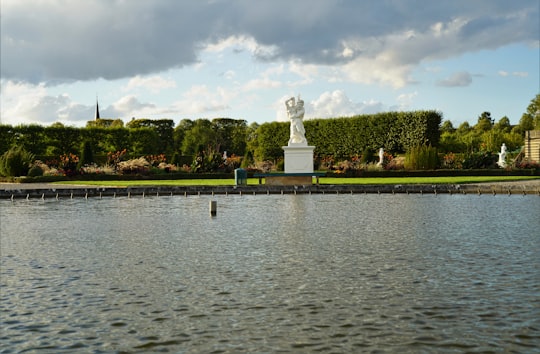 white statue of man on water fountain in Hannover Germany