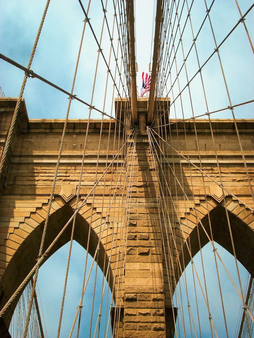 brown bridge under blue sky during daytime