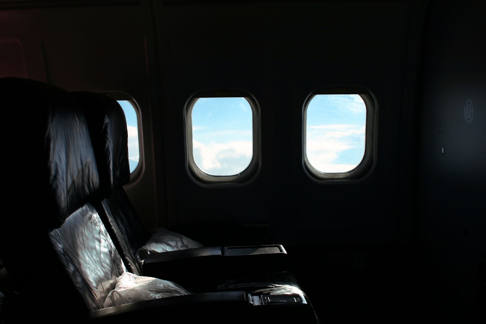 black leather car seat with white textile