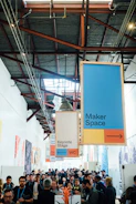A bustling community center where creators share ideas and network.