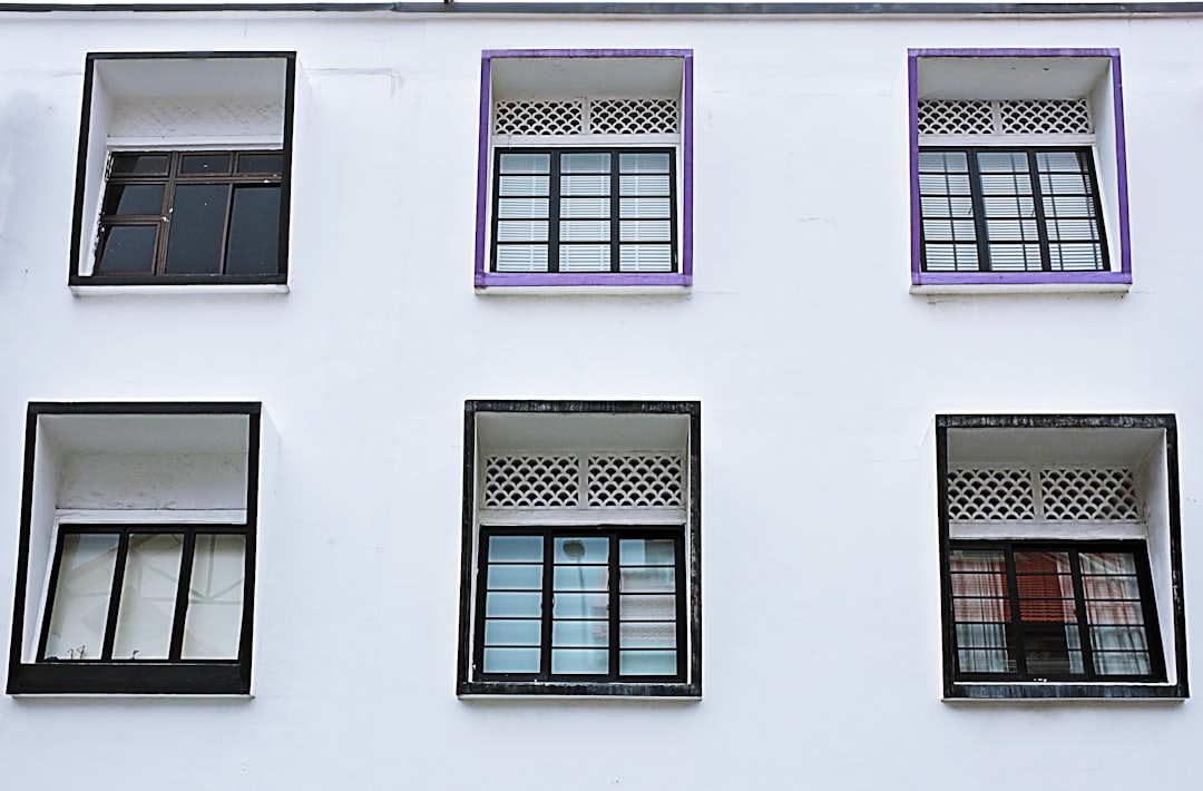 white wooden window frame on white concrete wall
