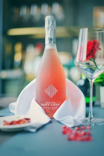 clear glass bottle on white ceramic plate