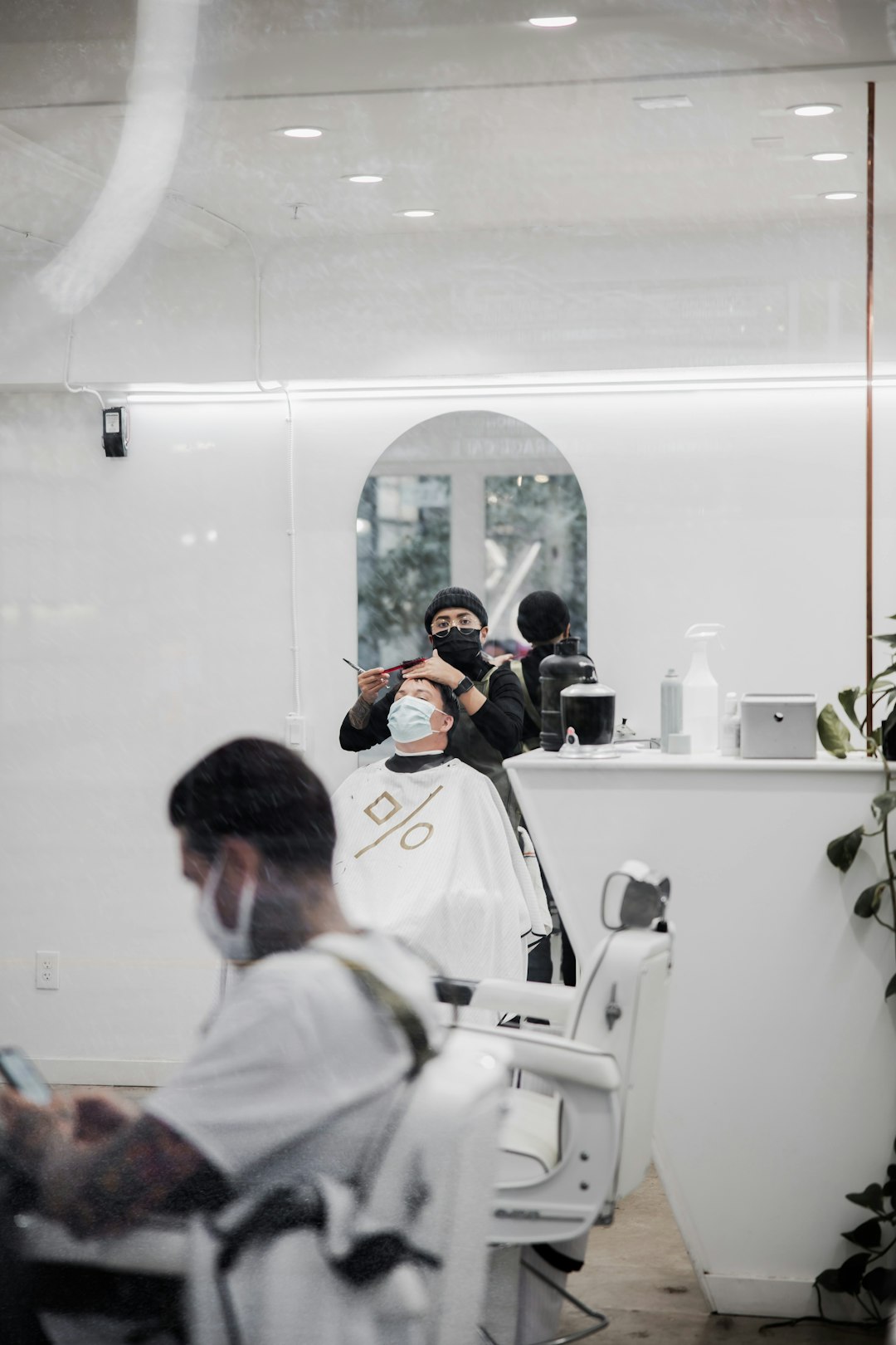 man in white shirt sitting on white chair