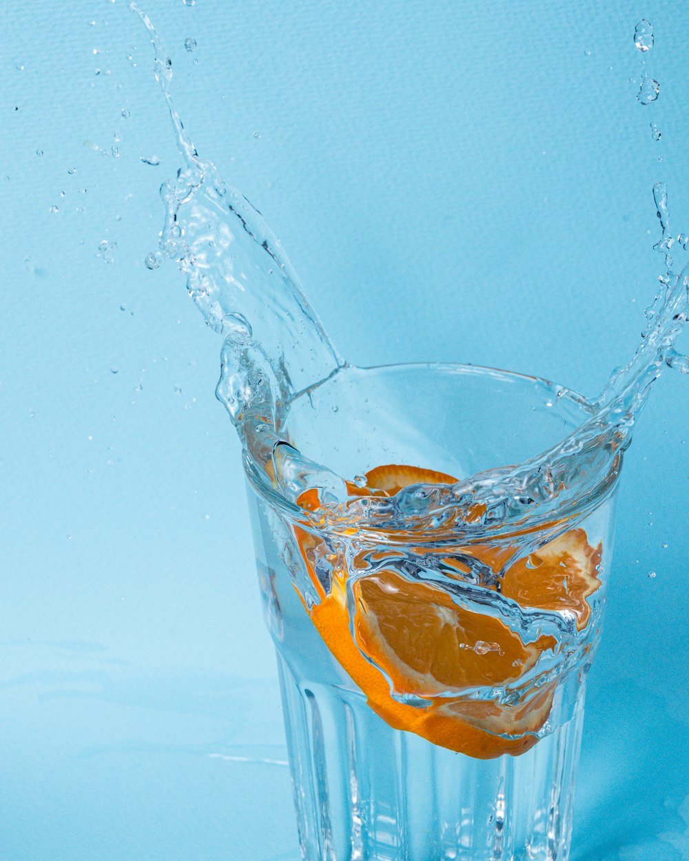 clear drinking glass with orange juice