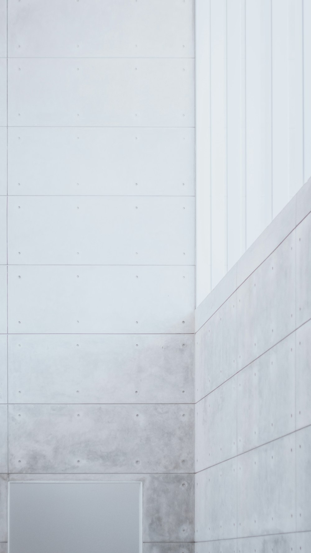 white concrete wall during daytime