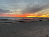 A scenic beach in Brazil with vibrant colors at sunset.