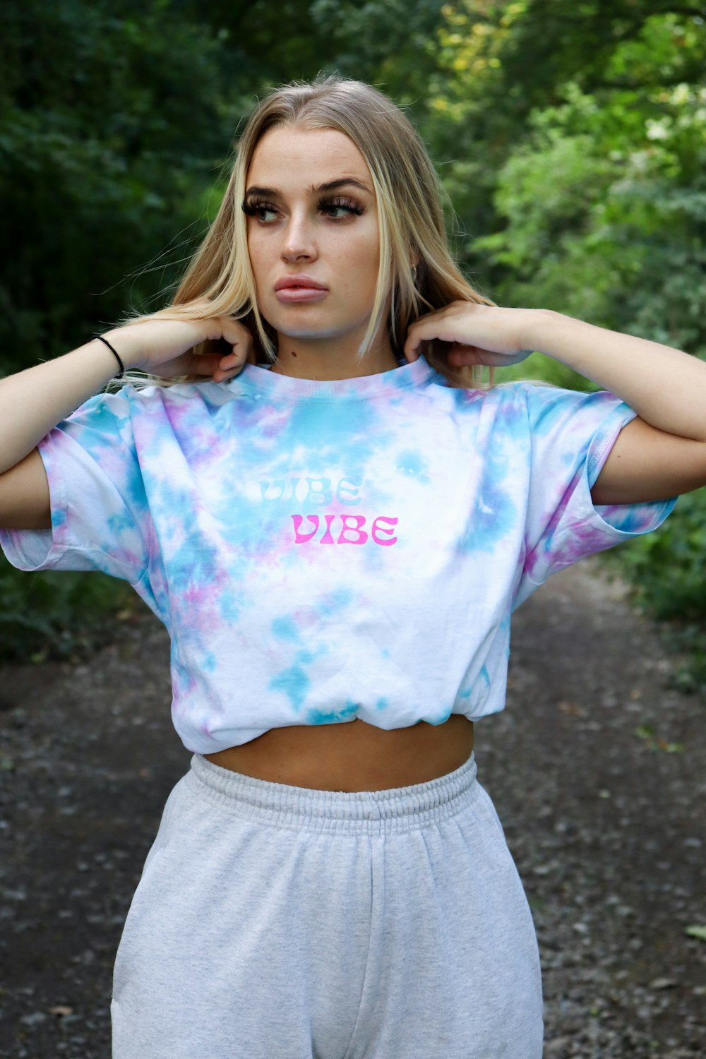 girl in purple and white t-shirt and gray shorts