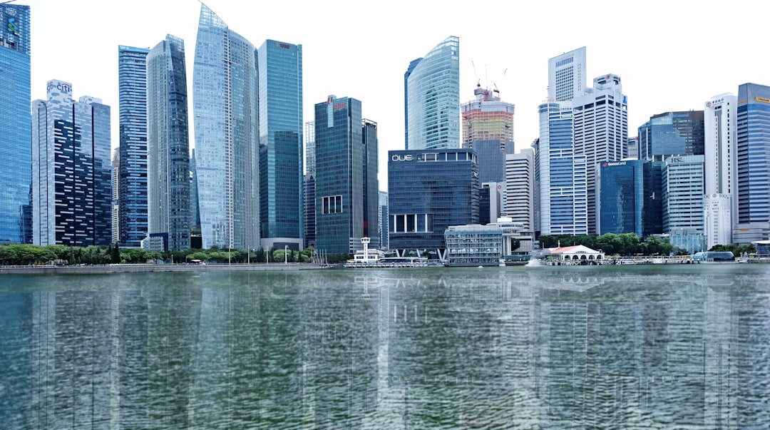 city buildings near body of water during daytime