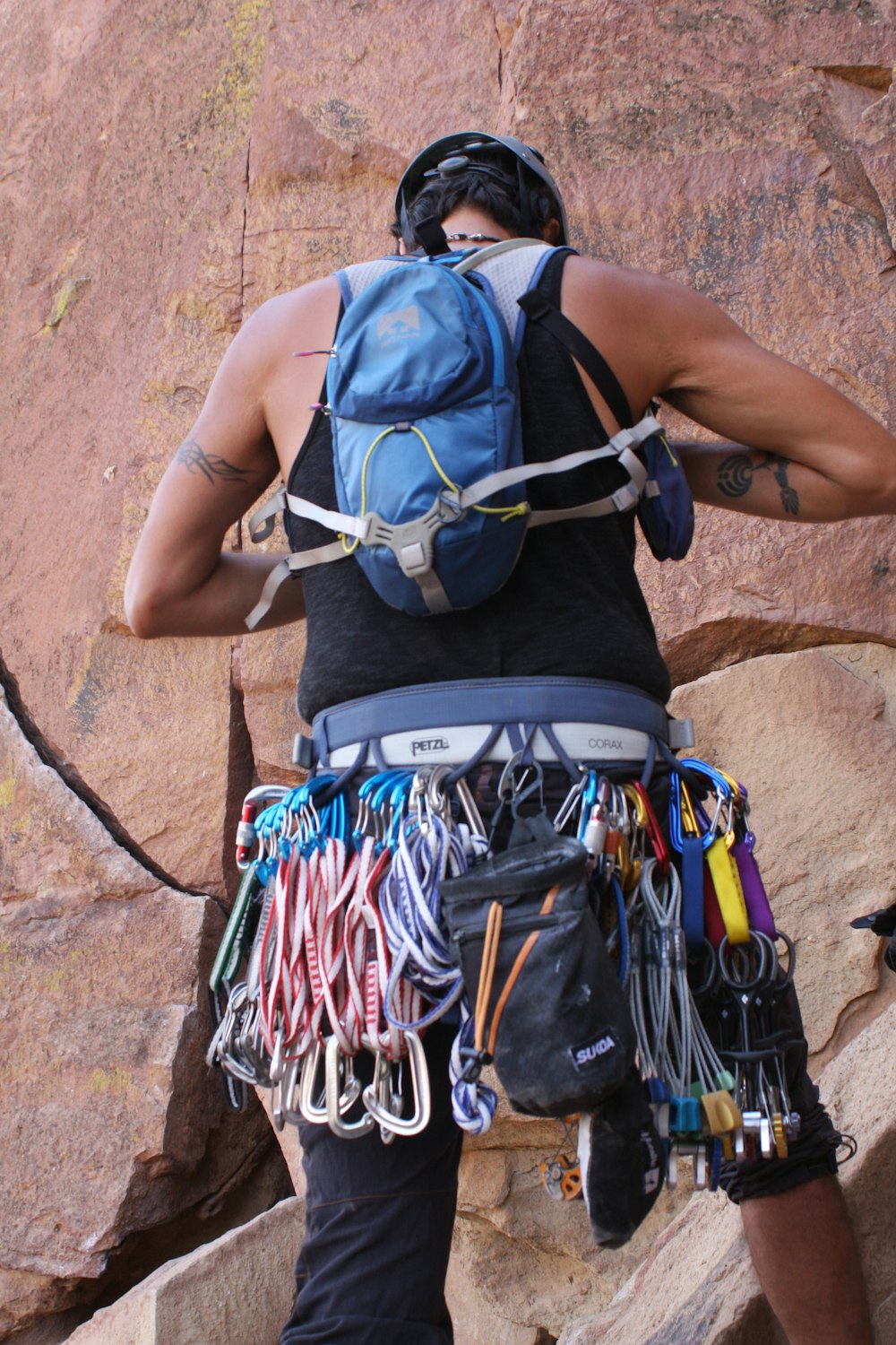 person in blue and black backpack