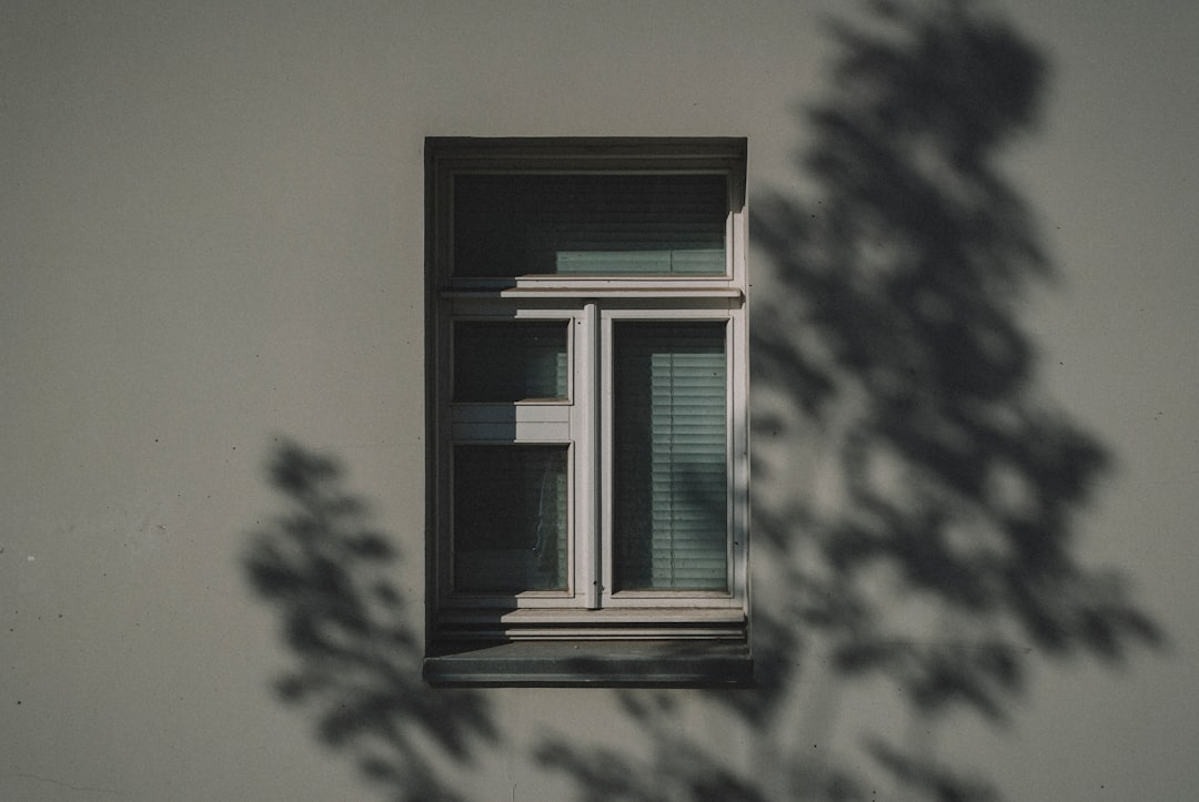 white wooden framed glass window