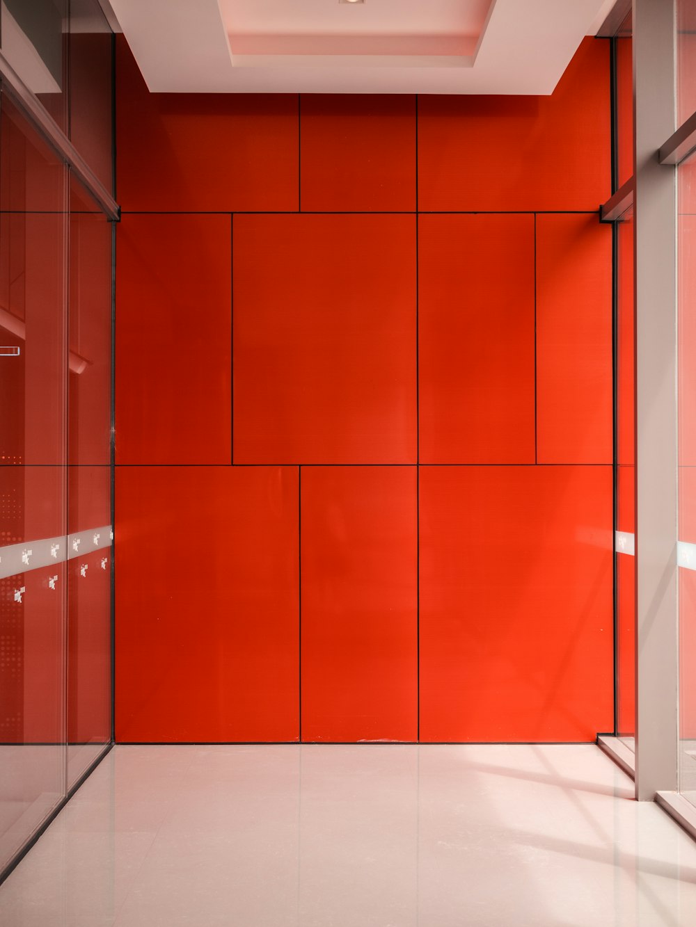 brown wooden door on white ceramic tiles