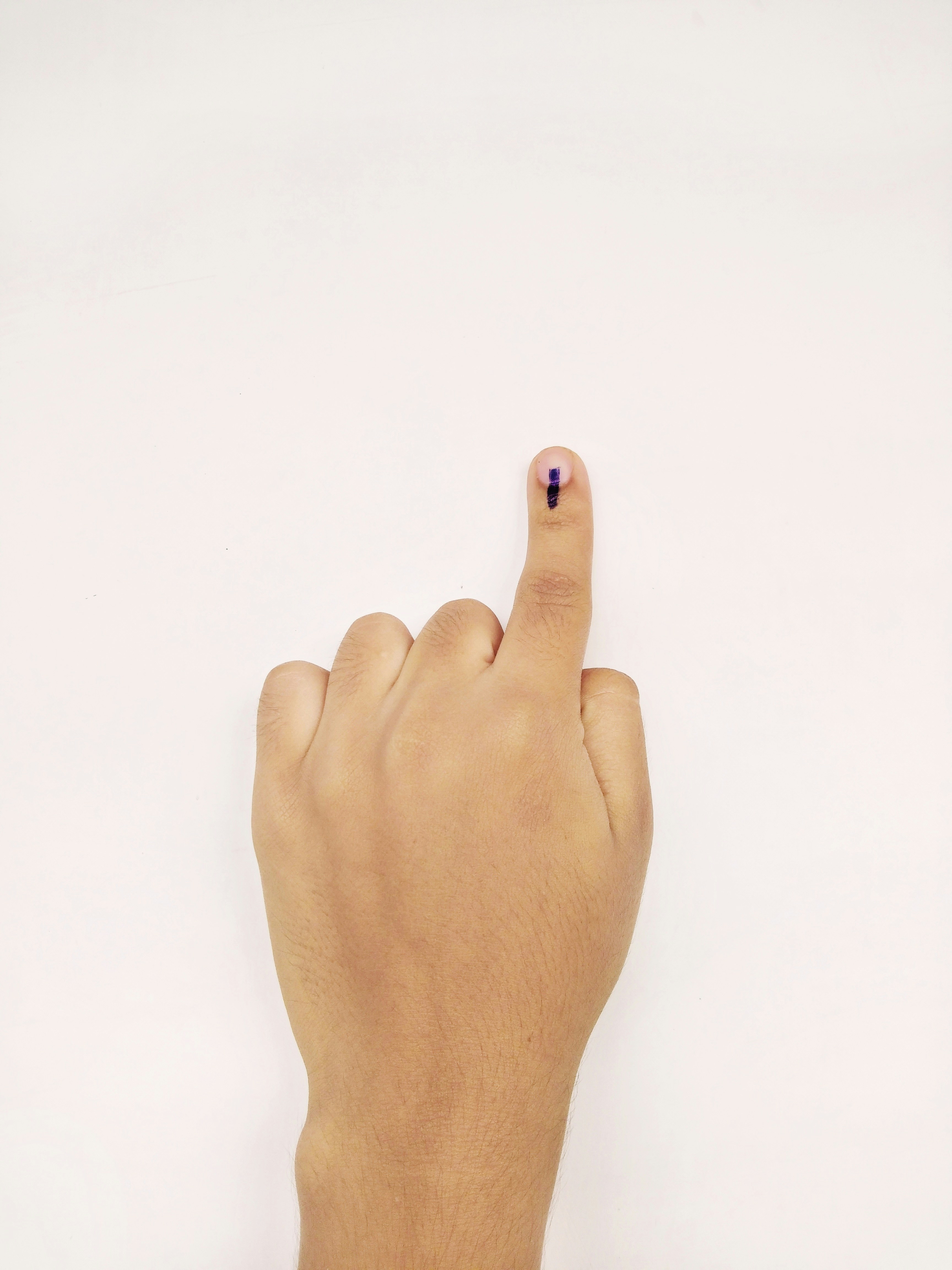 persons left foot with red nail polish