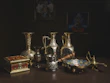 Bronze ladles and utensils arranged on a linen cloth with soft natural light highlighting their craftsmanship.