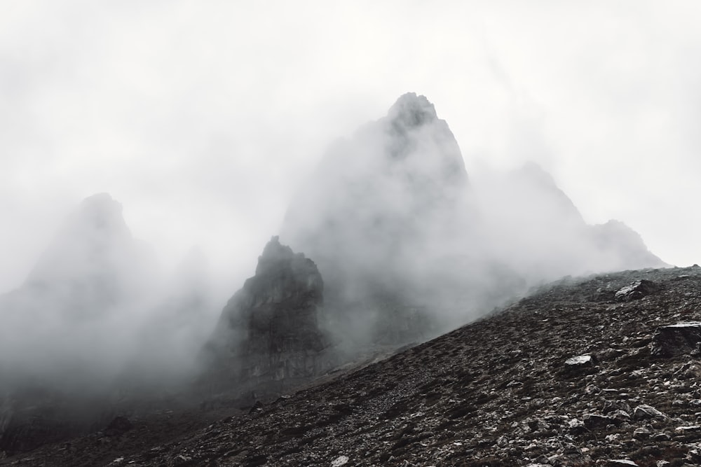 gray mountain with white clouds