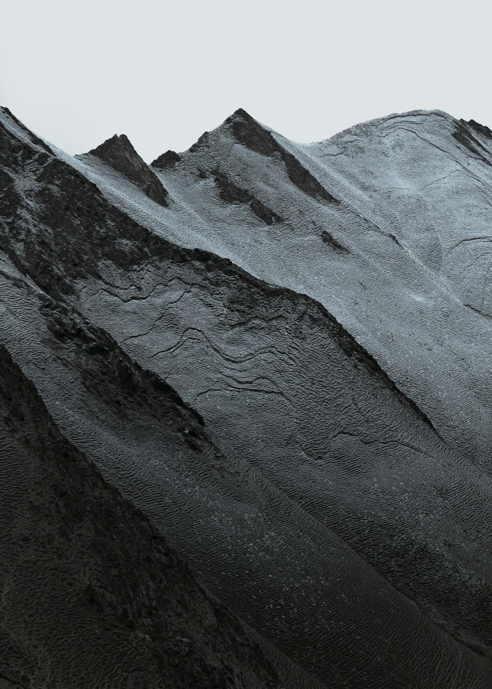 gray and black mountain under white sky during daytime