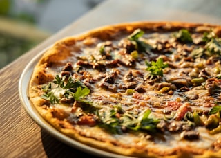 pizza on brown wooden table