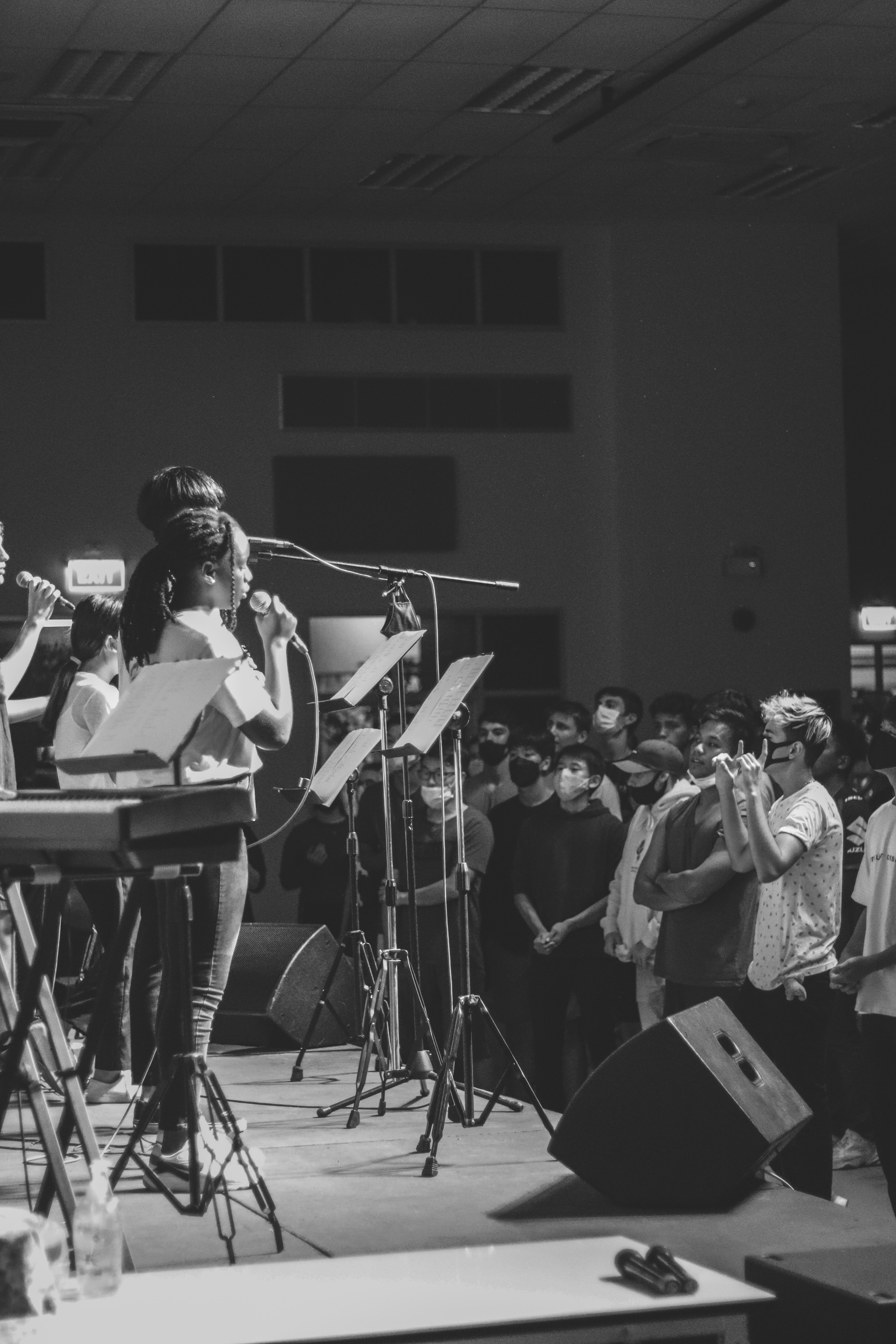 grayscale photo of band performing on stage