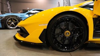 Close-up of shiny car accessories in black and yellow colors.